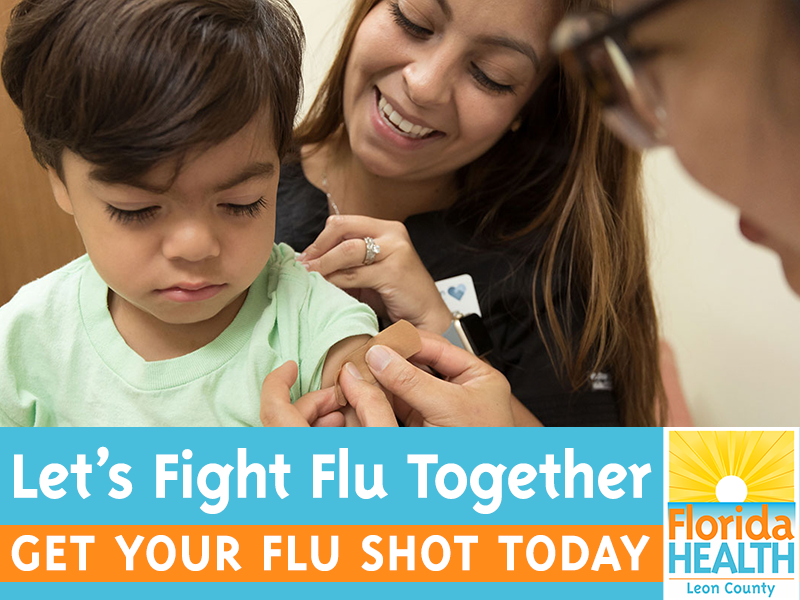 Young patient with mom receives flu shot