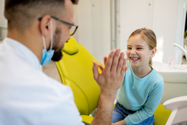 child smiling at dentist
